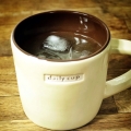 A whiskey sour in a mug