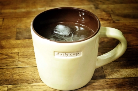 A whiskey sour in a mug